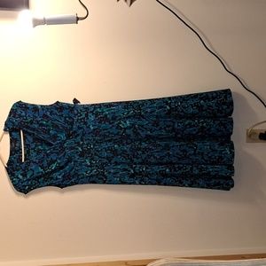 Chaps size large dress, blue, black, and teal. Has low, V neck. Stretchy materia